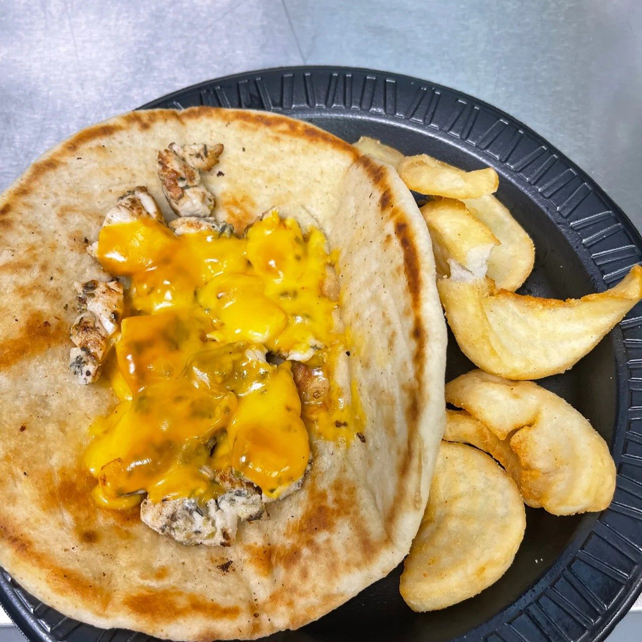 Kids Grilled Chicken on Pita with Fries.
